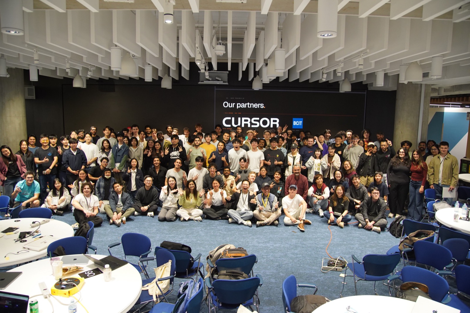 The full room of hackathon participants, sponsors, and organizers